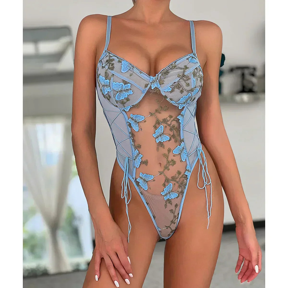 Aurora | Bodysuit med broderad fjäril